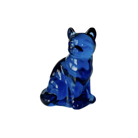 A blue glass statuette of a kitten.